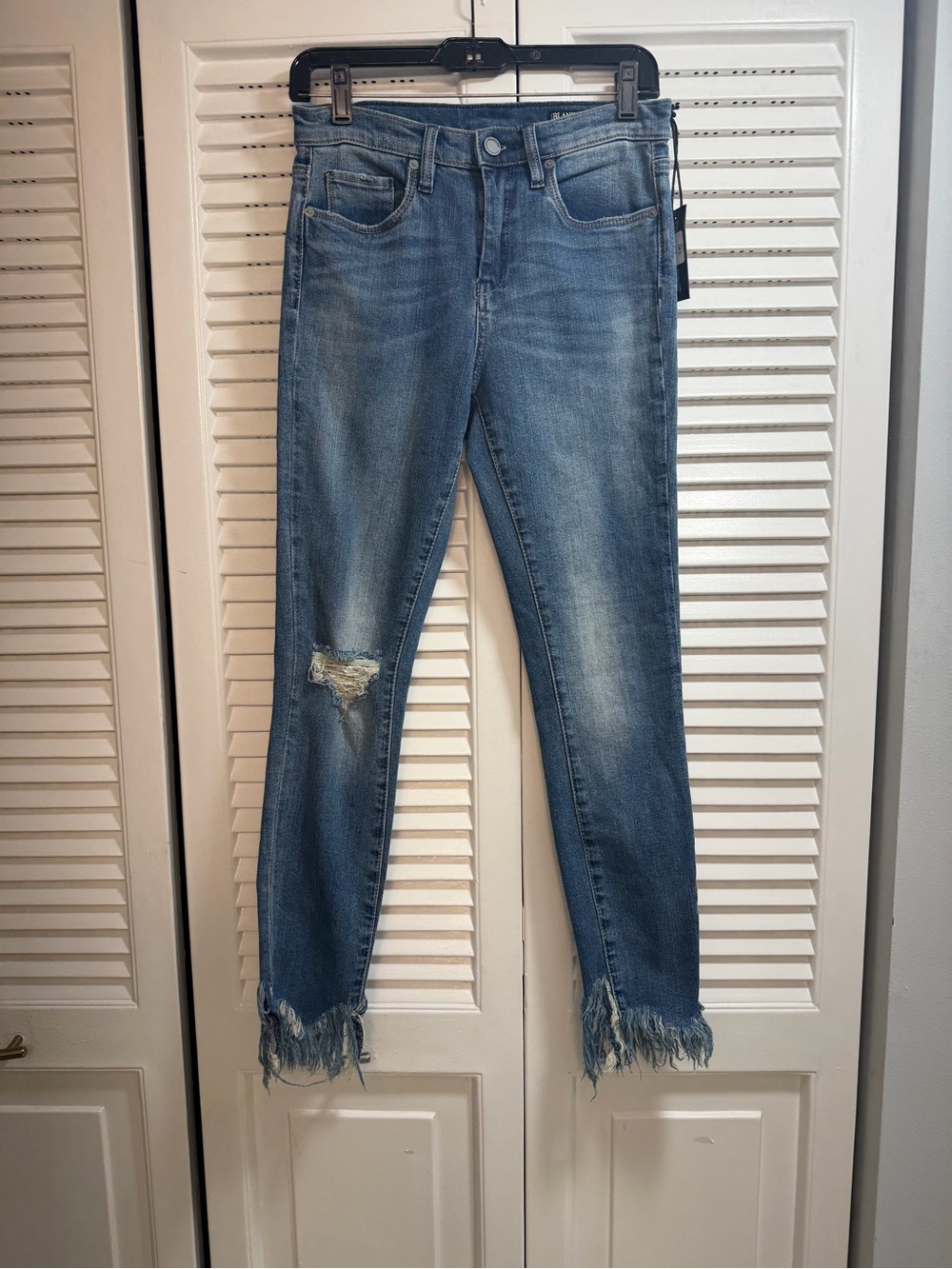 Blank NYC Great Jones Blue Skinny Jeans with Distressed Knee and Frayed Hem